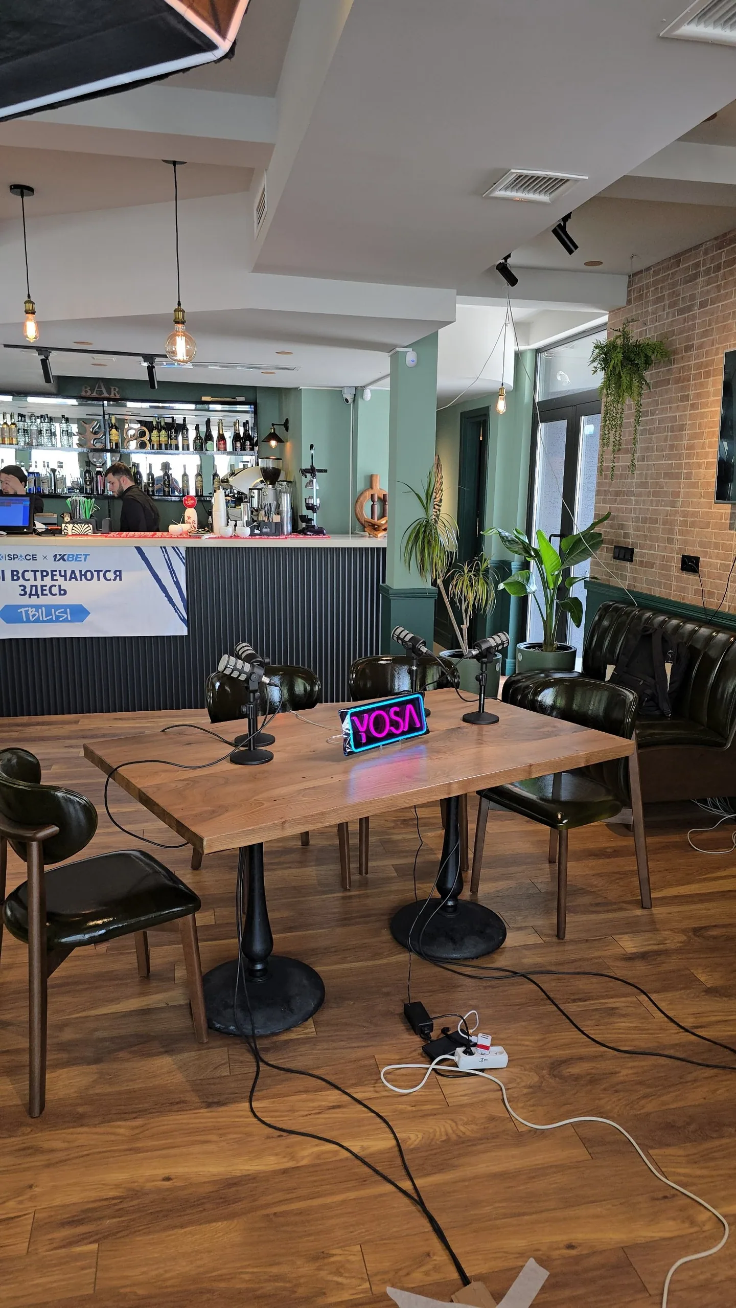 Podcast microphones and technical equipment prepared at a venue